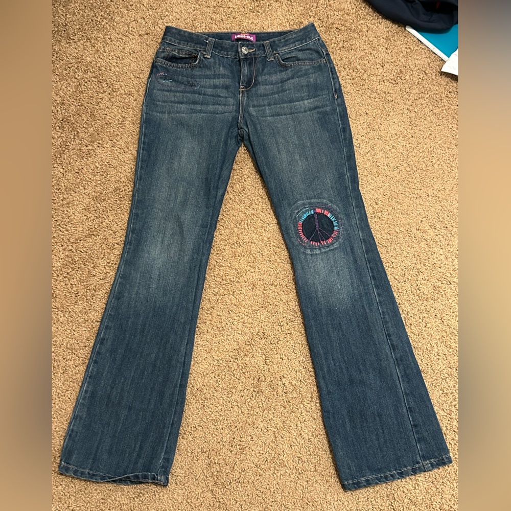Jeans with peace sign embroidery